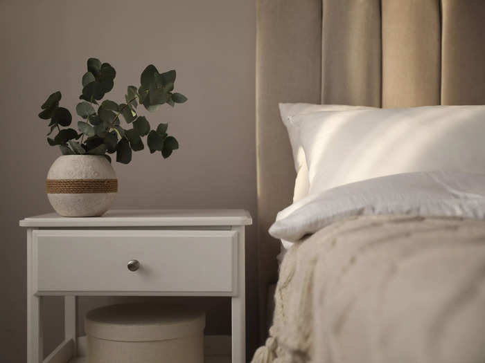 Find a nightstand with drawers and hidden storage to reduce clutter.