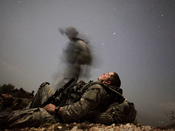 A U.S. soldier of 2-12 Infantry 4BCT-4ID Task Force Mountain Warrior takes a break during a night mission near Honaker Miracle camp at the Pesh valley of Kunar Province August 12, 2009.