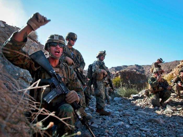 Marines throwing down during a gunfight in Afghanistan. Combat is loud. Marines are louder.