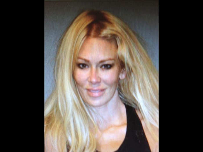 Porn star Jenna Jameson seems unfazed in her May 2012 mug shot, smiling seductively after she was arrested on suspicion of DUI.