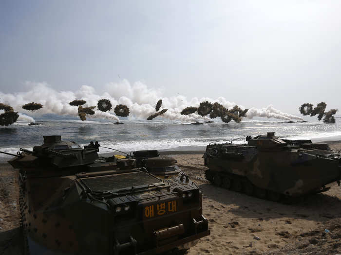 The drill features the landing of several amphibious assault vehicles.