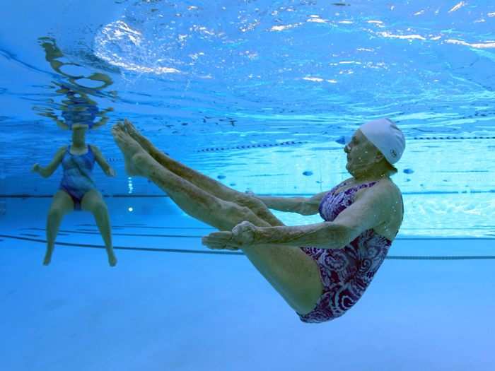Inge Natoli, 90, (R) practices synchronized swimming with Barbara Miller, 77, (L) in Sun City, Arizona, January, 2013. Sun City was built in 1959 by entrepreneur Del Webb as America's first active retirement community. Residents keep socialize at over 120 clubs with activities such as square dancing, ceramics, roller skating, computers, cheerleading, racquetball and yoga.