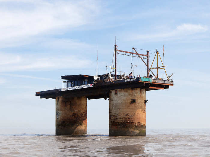 The first micronation that Delafontaine discovered and photographed was the Principality of Sealand. Located on an abandoned WWII military platform about 8 miles off the coast of Great Britain in international waters, the micronation was first established in 1967 by Paddy Roy Bates in order to emit pirate radio broadcasts.