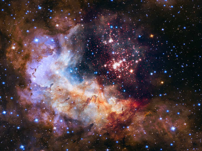 To commemorate Hubble's 25th anniversary, NASA released this jaw-dropping shot of some of our galaxy's hottest, brightest, most massive stars contained in the giant cluster at the center of this image. The powerful winds the stars in this cluster generate have hurricane-like force that pushes the surrounding gas away, which is the beautiful cloud of purple, blue and orange you see to the left and bottom.