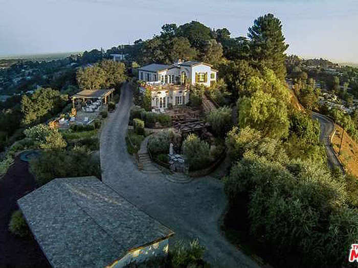 Welcome to Tom Cruise's Hollywood Hills compound. The home is right off of the famous Mulholland Drive, shielded from the street by fences and gates with a long, winding driveway.