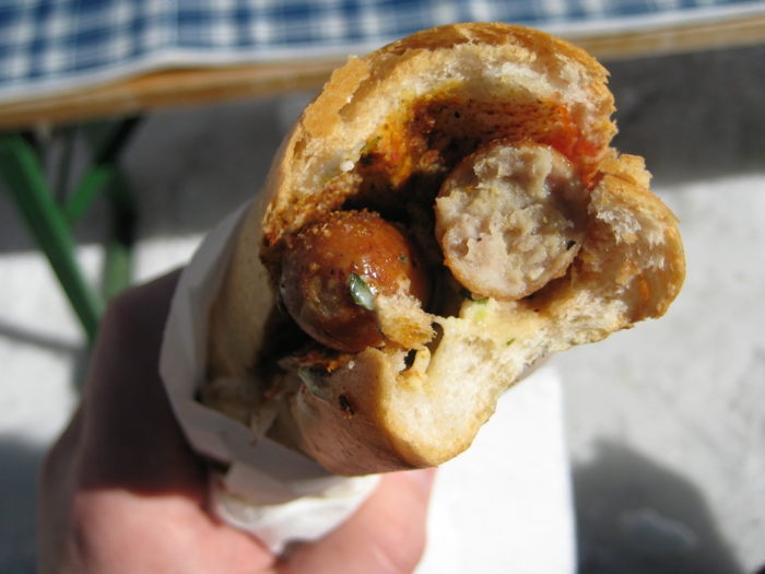 AUSTRIA: Bosna is a spicy Austrian dish consisting of Bratwurst sausage, onions, and a blend of curry powder and mustard or ketchup, served on a roll.