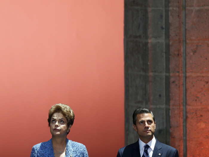 MEXICO: Mexico's President Enrique Pena Nieto, right, and Brazil's President Dilma Rousseff look up during a welcome ceremony at the National Palace in Mexico City, May 26, 2015.
