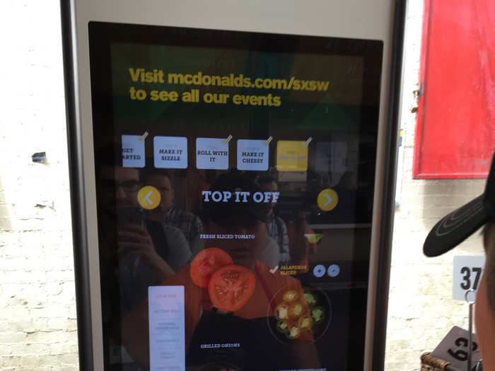 To choose which topping you want, you swipe down like on smartphone or iPad, tapping when you see something you like.