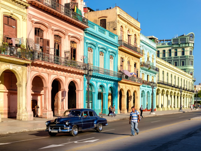 Havana, Cuba — Take a trip back in time as you stroll Havana's colorful neighborhoods. You'll find bright-colored buildings and vintage cars lining the streets. Look to the rooftops and note their distinct Moorish style.