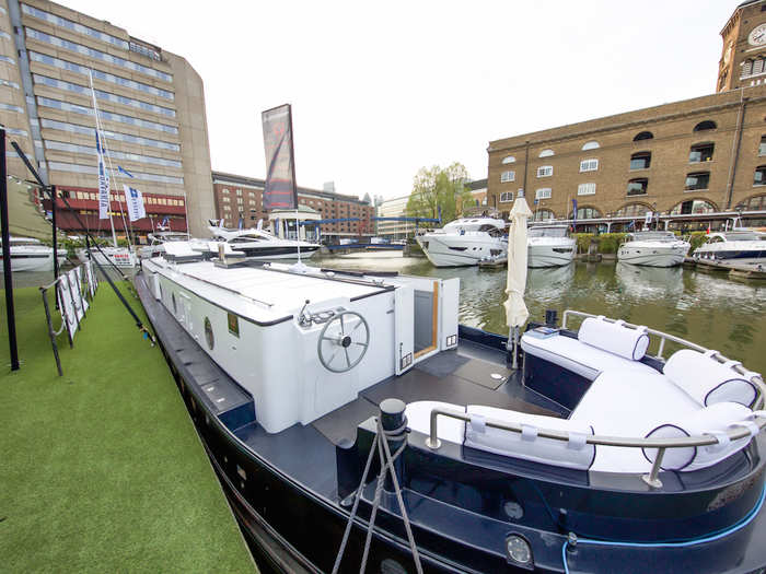 Welcome to Alex Prindiville's home: a boat moored at St. Katherine's Docks in east London. The boat is accessible via the back, where there is a small outdoor section with seating for up to six people. This area is ideal for al fresco dining during the summer, Prindiville said.