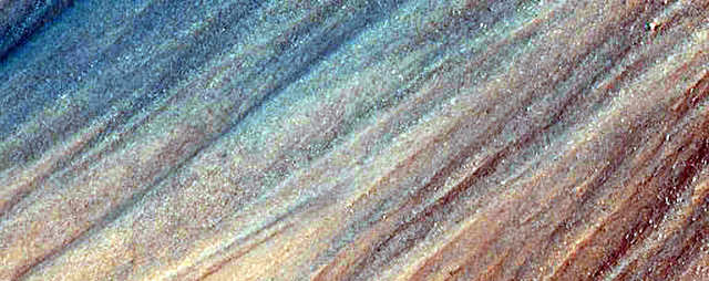 A rainbow-colored sprinkling of minerals on a Martian slope.