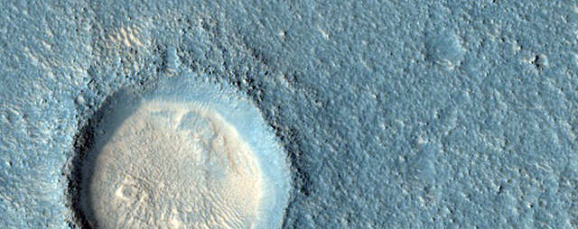 A crater on Arcadia Planitia, a large flat region of Mars.