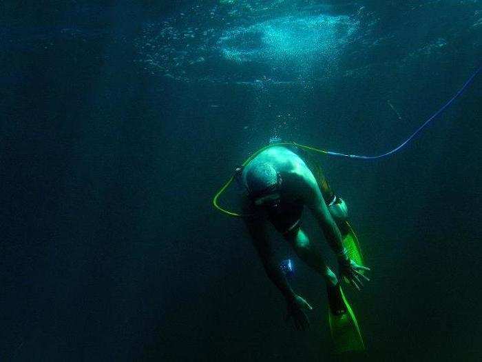 Select members of the Coast Guard are also trained to Snuba — a method of diving similar to Scuba in which the diver breathes air from a tube connected to a ship. Here, a member of the Coast Guard Snubas for the first time off the coast of Honduras.