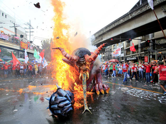 Protesters in the Philippines burned a sculpture of President Rodrigo Duterte during a May Day rally outside the presidential palace in Manila.