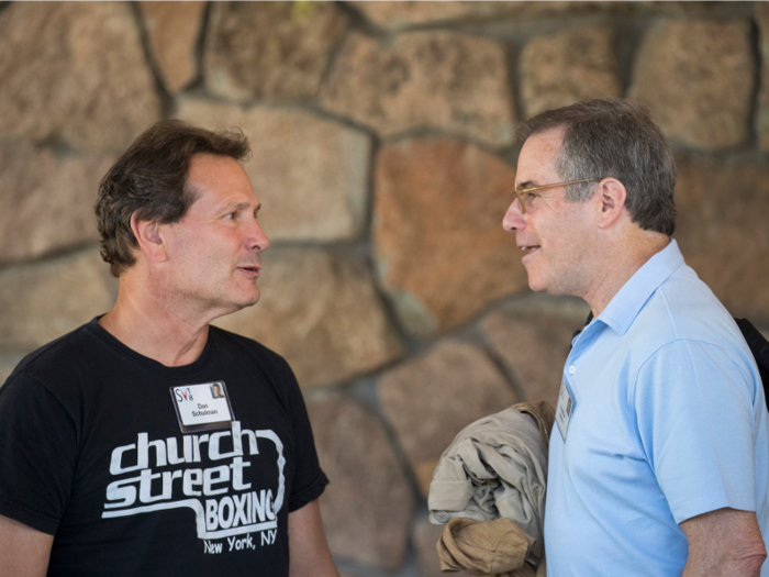PayPal CEO Dan Schulman, left, chats with Jonathan Nelson, founder of Providence Equity Partners.