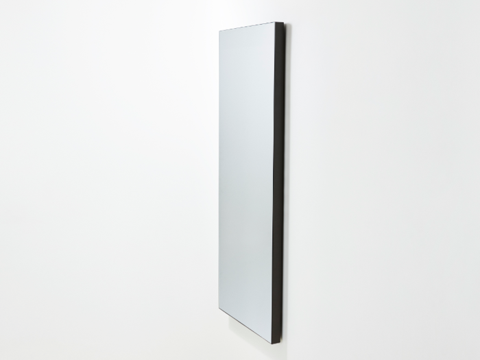 The product, appropriately called "Mirror," has an LCD screen but looks like a regular mirror when it's turned off. It can come as a wall mount or with a minimalist carbon steel stand.