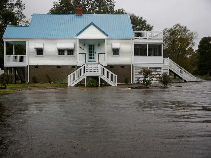 Water from the Neuse River has toppled the banks and swallowed up multiple streets in New Bern, North Carolina.