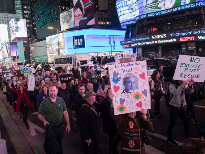Demonstrators march through Times Square in support of special counsel Robert Mueller.