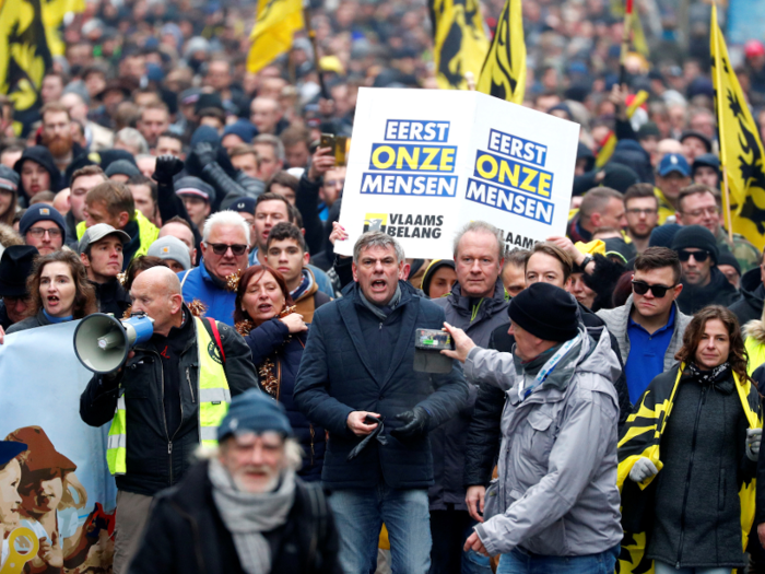 Thousands of protesters gathered in Brussels, including Filip Dewinter (center), a leading figure in Vlaams Belang, a right-wing Flemish nationalist party.