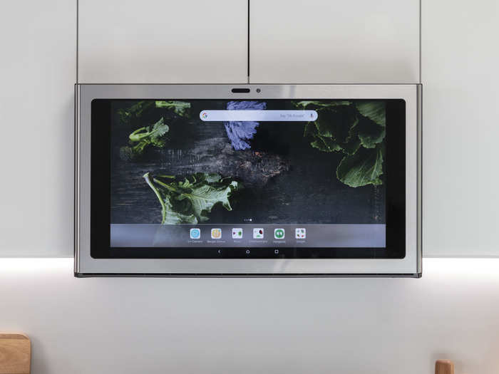 This is GE's Kitchen Hub, a 27-inch smart touchscreen display powered with Google Assistant to respond to voice commands. The hub is designed to slide right into the space above your stove, where you would find your exhaust vent or a microwave.