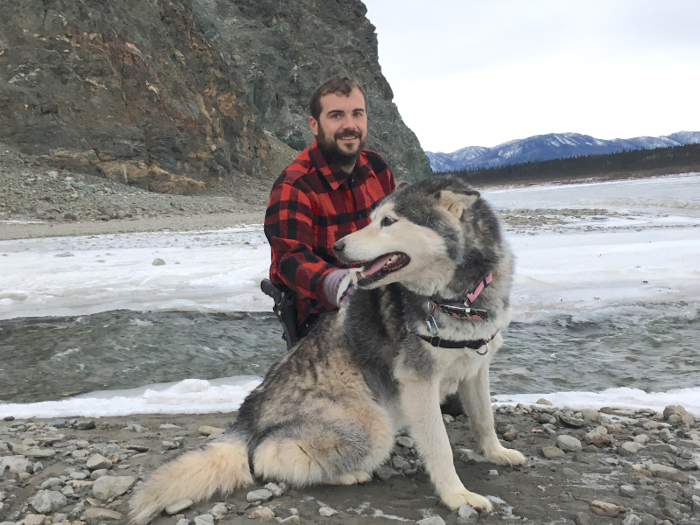 Daniel Helmer, pictured here with his dog Galena, and his wife use the dividend to stock up on fuel and food before winter cuts them off from the rest of Alaska.
