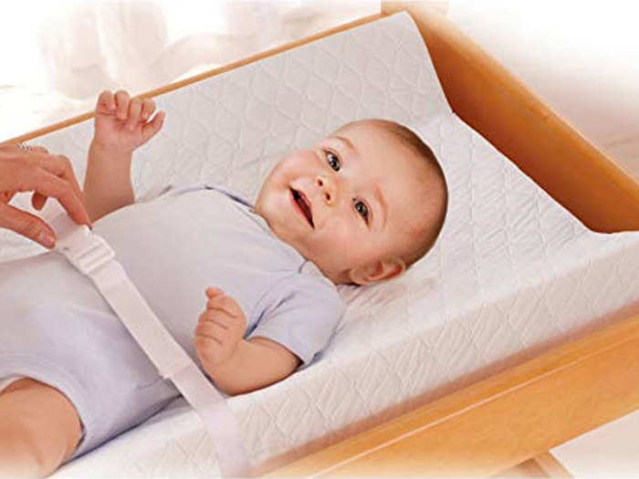 A soft, foam changing pad that keeps baby secure