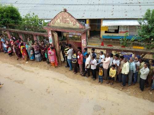 People queue up early morning to cast their vote at a polling centre in Agartala April 11, 2019.