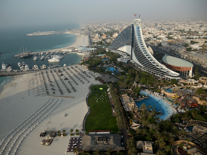 To start with, let's talk about location and architecture. The Jumierah Beach Hotel sits on its own private beach on the Dubai coastline. Its iconic wave-shaped building is one of Dubai's most recognizable.