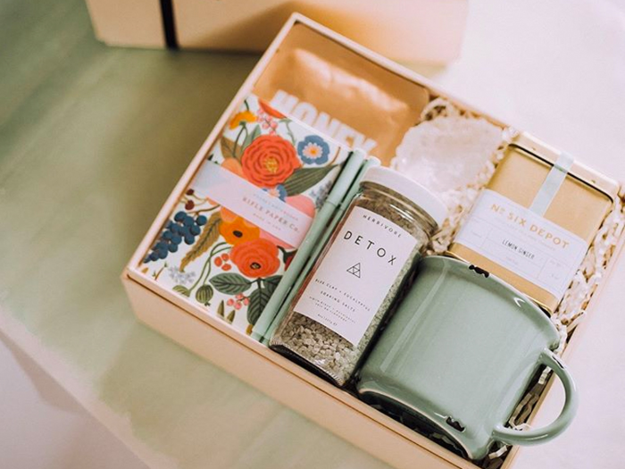 A gift box that combines sweets, home decor, books, and other small accessories she'll love