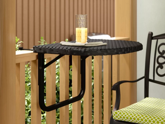 A personal table that can attach to a railing
