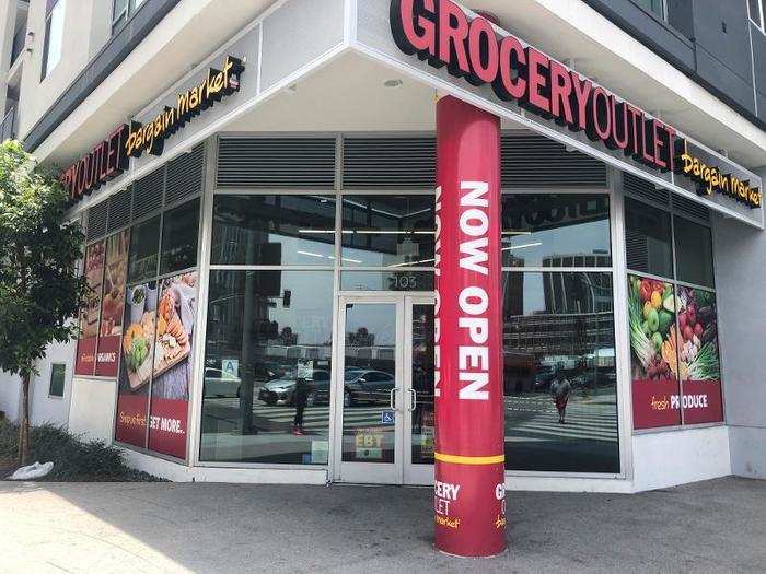 The street entrance to this Grocery Outlet was boldly branded in red and yellow with inviting graphics. Let's go shopping.