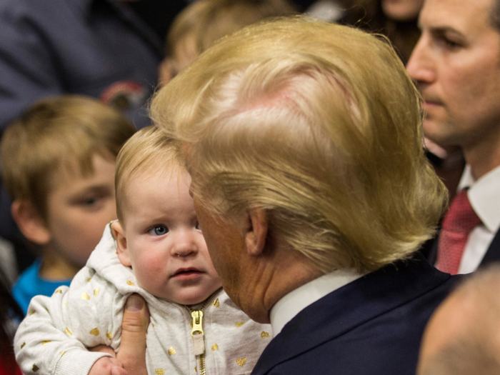 A baby gets a close look at the then-presidential candidate on the campaign trail.
