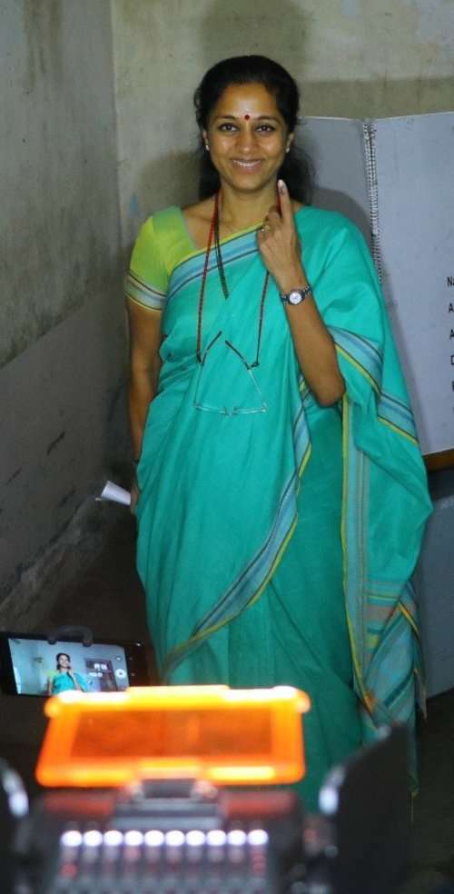 Supriya Sule of Nationalist Congress Party casts her vote in Mumbai