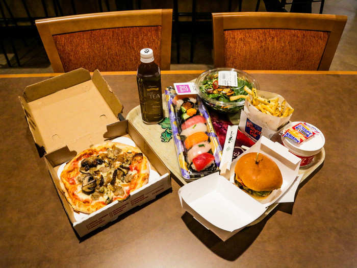 What I ordered: a small four-topping pizza, bottle of Wegmans oolong tea, nine-piece sushi deluxe, spicy Southwest chicken and rice soup, a Nutty Professor salad, and an American classic burger with Tuscan fries. In total, everything cost $57.79 before tax. Not bad for New York, considering this was basically four full meals.