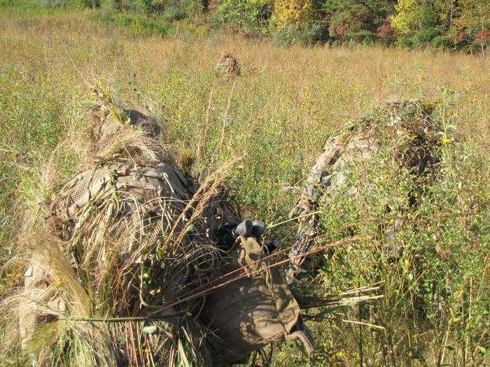 The snipers were given 10 minutes to "veg up," a term for the customization of their ghillie suits using vegetation, at a "veg" site roughly 1,000 yards from their target.