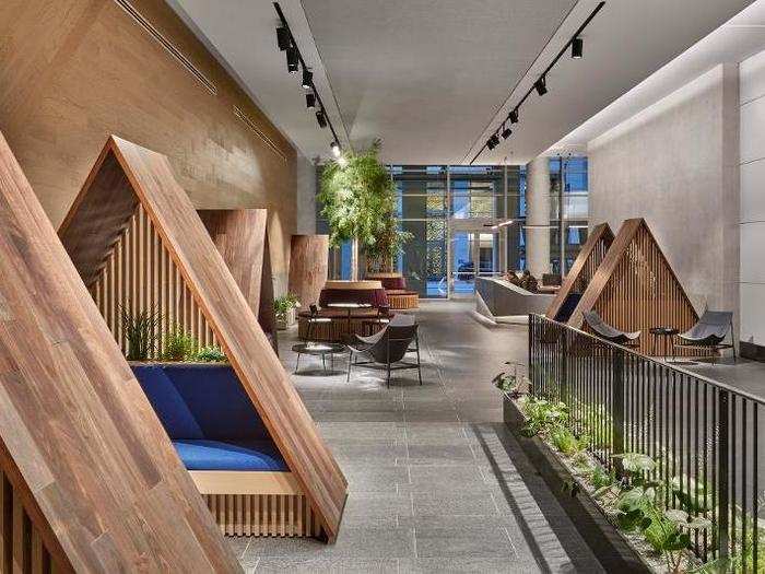 The lobby is designed like a "base camp," with tent-like benches for meetings before venturing upstairs.