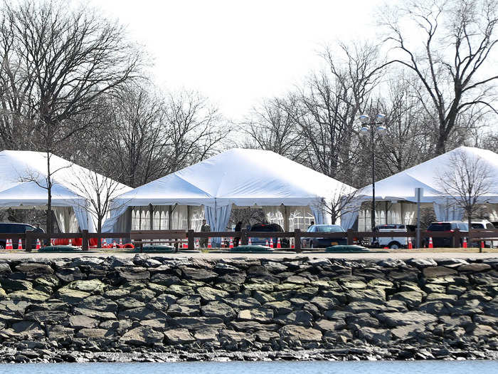 Tents, trailers, and other makeshift structures have been set up to create temporary drive-through testing facilities, like this one in New Rochelle, New York.