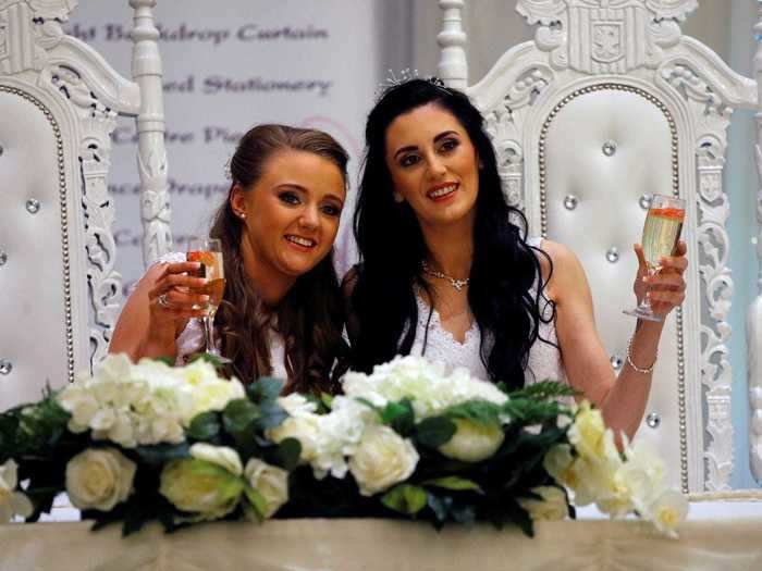 Finally, here's Sharni Edwards and Robyn Peoples in Northern Ireland, who married in February 2020. In her wedding speech, Peoples thanked the activists who campaigned alongside them to make same-sex marriage a reality. Cheers, ladies.