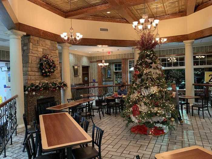 The restaurant features everything from red oak tables to a self-playing baby grand piano, wrought iron railings, and a fireplace.