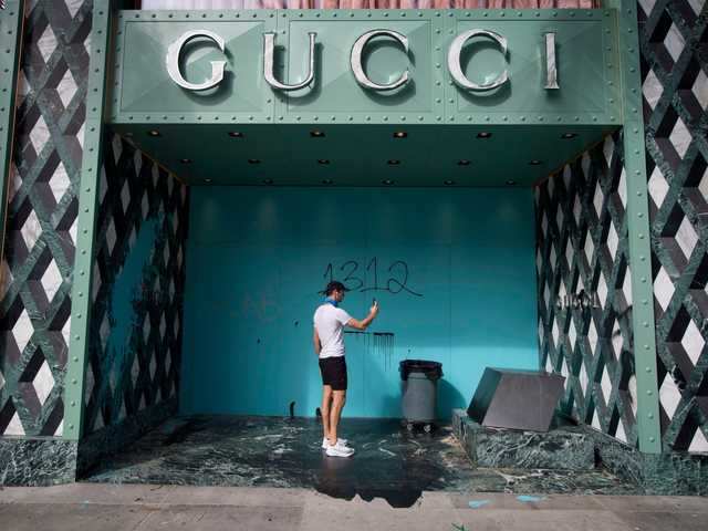 Shattered storefronts and &#39;eat the rich&#39; graffiti: Photos show the aftermath of destruction in ...