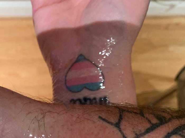 A transgender man was surprised to learn his parents got matching tattoos of the trans flag after he came out.