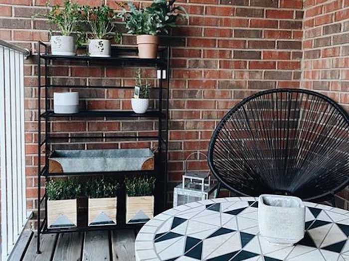 Kristin brightened her small patio with a geometric table and a plethora of plant life.