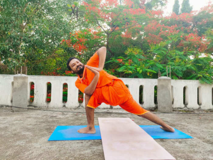 Yoga enthusiasts performed exercises in their homes or in small groups in the outdoors keeping in mind the social distancing norms as no major camps were organised due to the COVID-19 pandemic.