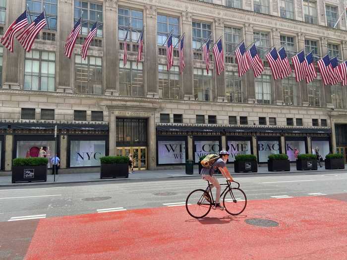 As I approached an eerily empty Fifth Avenue, I immediately saw the Saks windows jubilantly welcoming shoppers back.