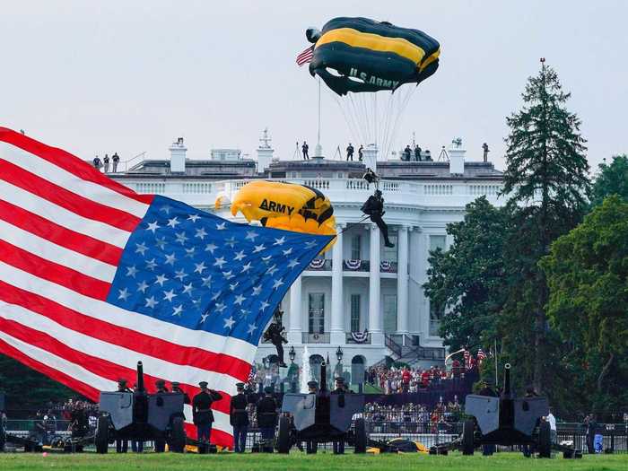 The celebrations featured a performance by the US Army's Golden Knights parachute team, who floated through the air carrying an American flag.