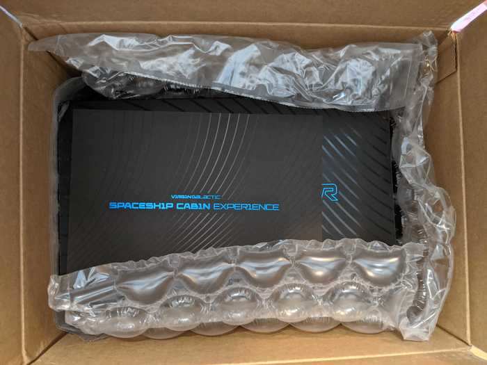 Our experience started with a Virgin Galactic-branded "spaceship cabin experience" box for Oculus Quest, a virtual-reality headset released in 2019.