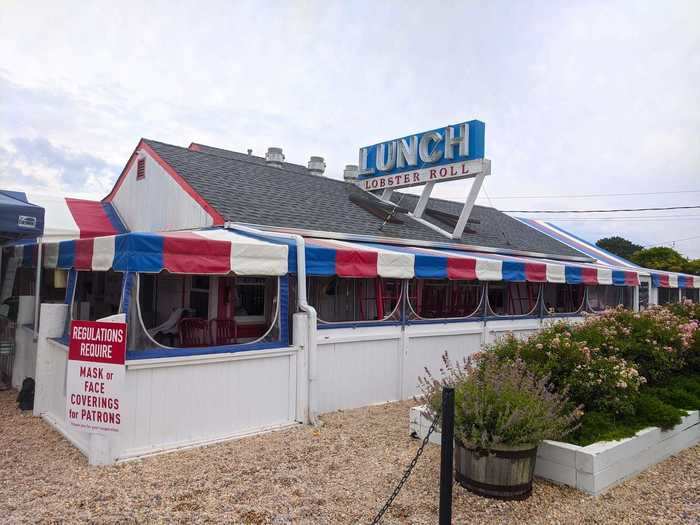 The Lobster Roll oozes Americana with its patriotic red, white, and blue awning. It features a beautiful, plant-covered outdoor patio that makes you forget just how close to the highway you're sitting.