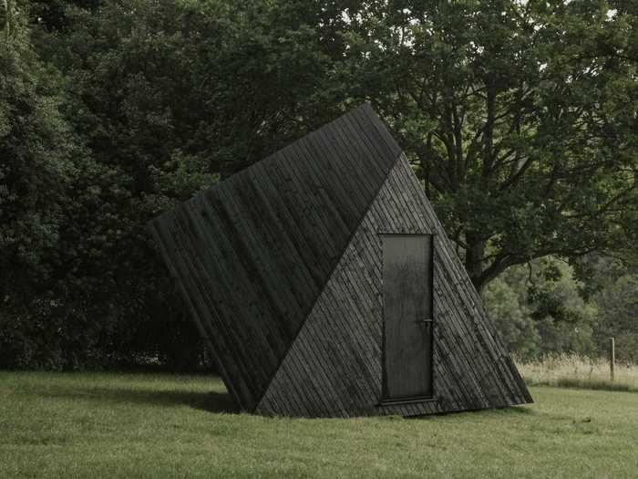 The small cabins are multi-sided geometric structures that look like sculptures.