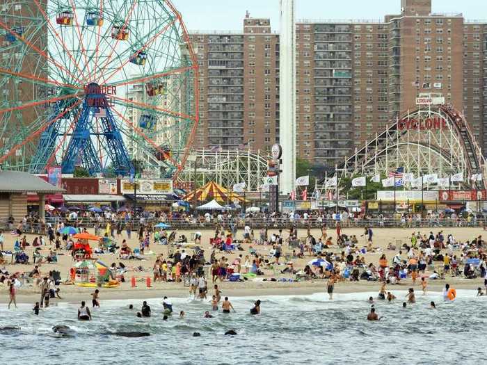 People flock to Coney Island in Brooklyn, New York, for the famous Cyclone roller coaster and Nathan's Famous hot dogs.
