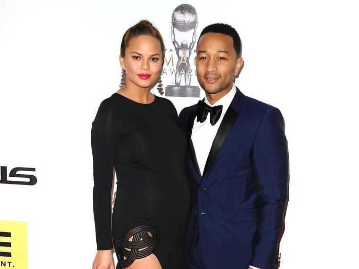 Chrissy Teigen showed off her first baby bump with an edgy gown.